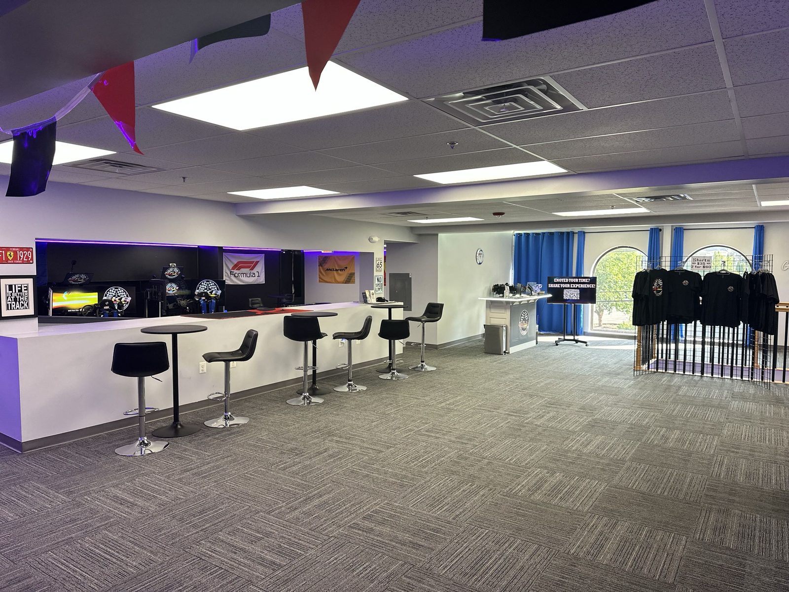 SKR lobby with bar counter, stools, and merchandise display